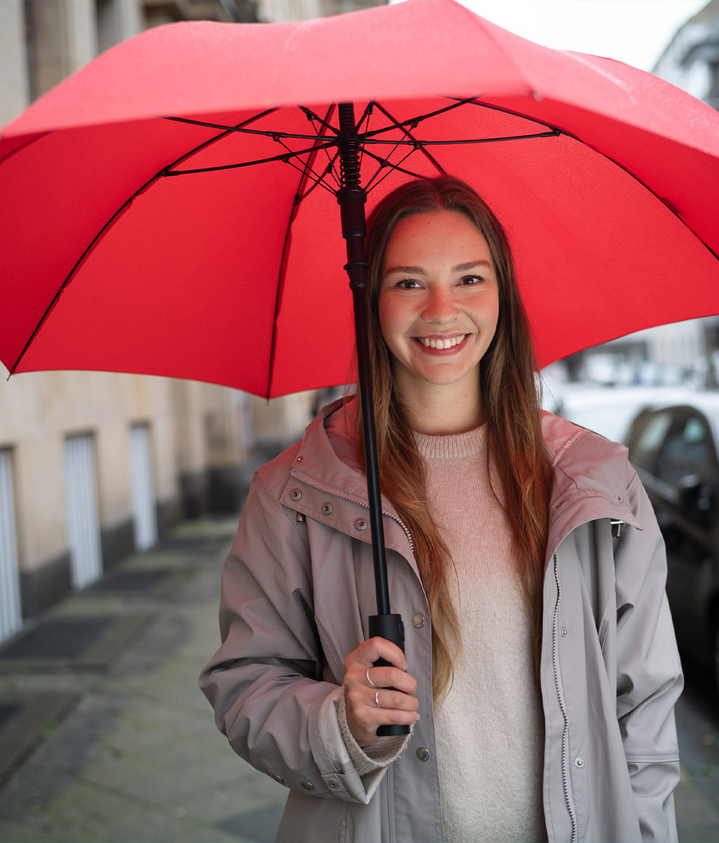woman with regular umbrella in red