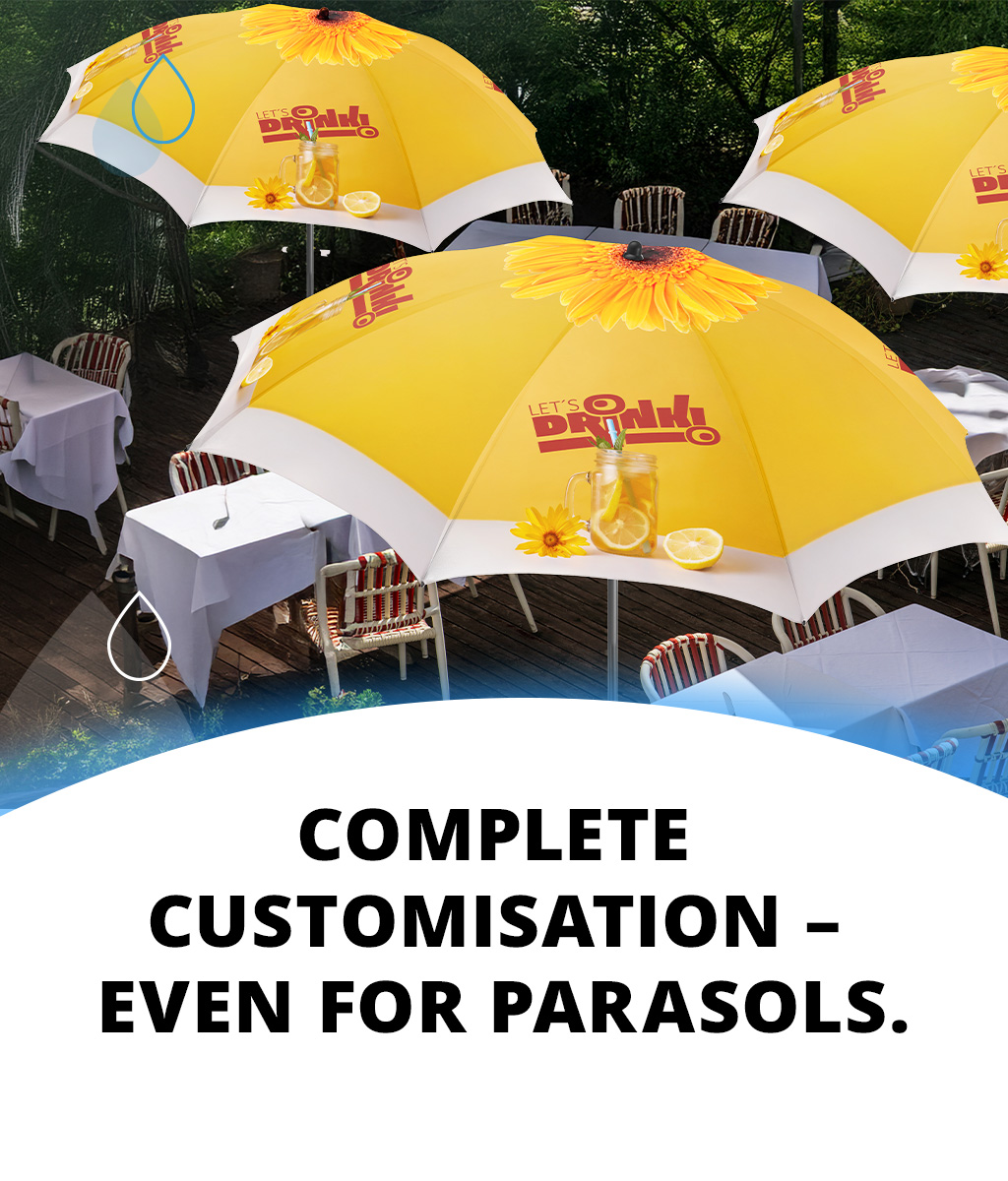 An advertising banner featuring yellow and white parasols on an outdoor terrace. The parasols are individually designed with logos and summery motifs; on the left is the text: “Fully available for individualisation – even for parasols.”