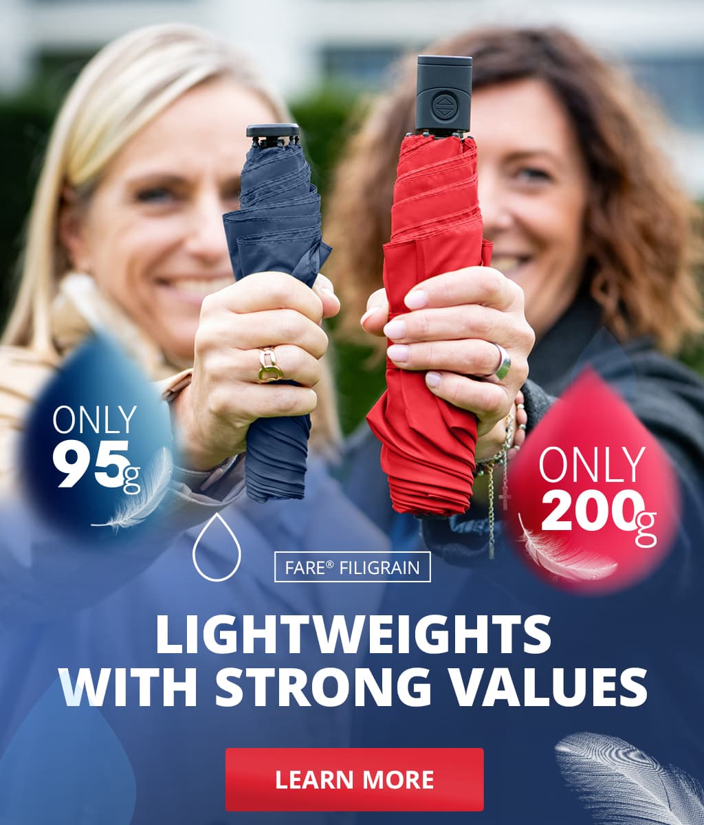 Banner with the FARE feather-light umbrellas Only95 and Only200: Two women with umbrellas show the Only95 and Only200. Text: ‘Lightweights with strong values – Learn more